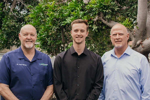 Chiropractors John Warren Austin Warren And Daniel Warren Together Outside